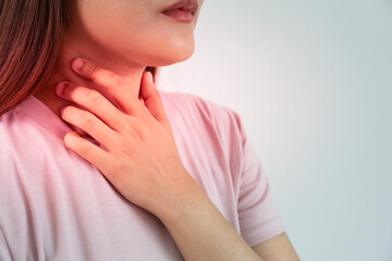  woman put on neck due to a sore throat. female tonsillitis causes a inflammation. treated by...