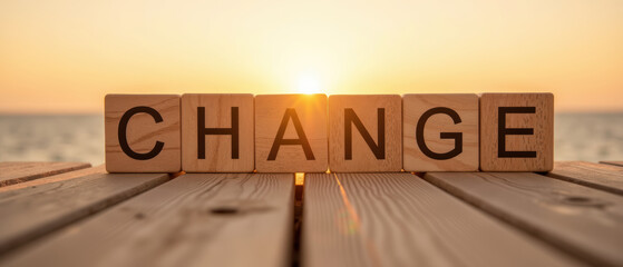 Change is powerful concept symbolized by wooden blocks against sunset backdrop, evoking feelings of transformation and new beginnings