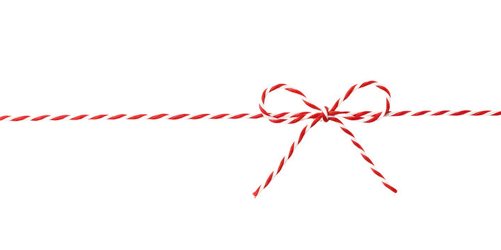 Red and white string rope with bow against on white or transparent background