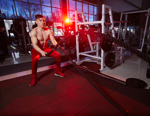 Intense battle rope workout in modern gym