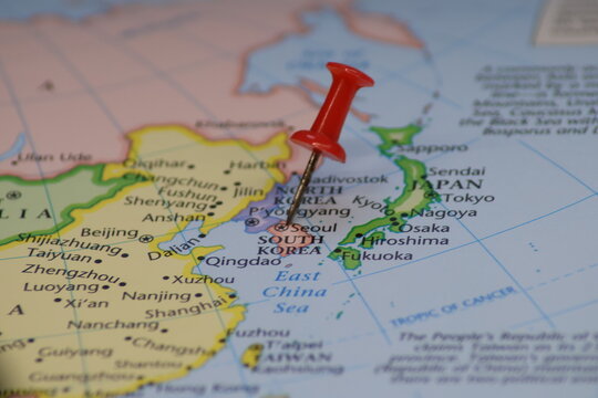 Red pushpin showing location of Seoul capital city of South Korea on geographical map. Travel destination concept, navigation point for tourism and business. Asia geography macro close up view details