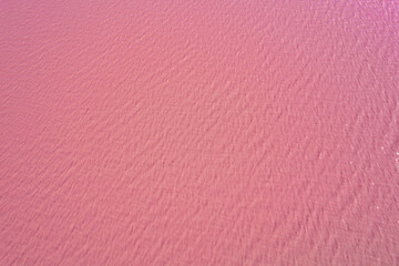 Aerial view of pink lake surface texture