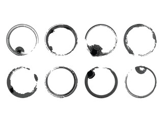 Eight circular coffee cup stains arranged in two rows against a white background.