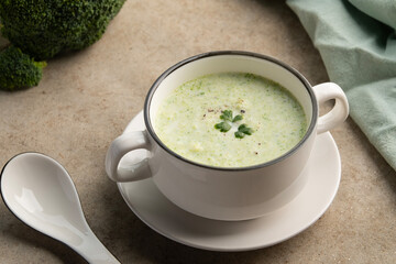 Cream of broccoli soup in white bowl.Healthy vegan dish.