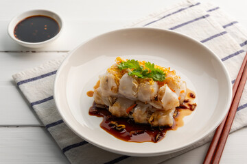 Chinese Steamed Rice Noodle Roll with shrimp and crispy tofu topped with sweet soybean vinaigrette.Thai snack food.(Kuay Thiao Lord)