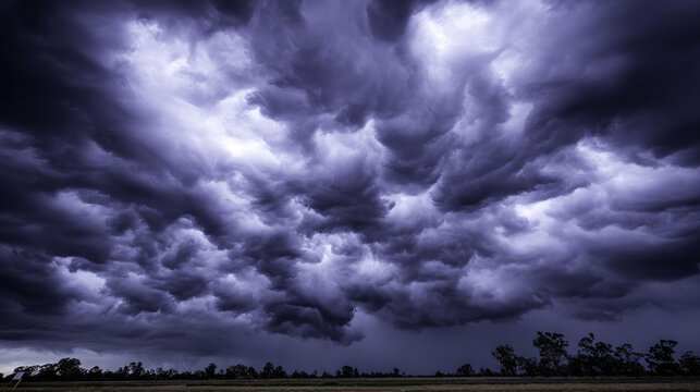 midgard. Dark purple storm clouds gathering before rainfall, dramatic sky formation, natural weather phenomenon. travel magazines, destination branding, designed for travel destination branding.
