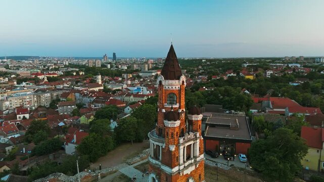 Aerial view of the historic Gardos Tower standing tall, surrounded by lush greenery and parked cars, Belgrade, City of Belgrade, Serbia.