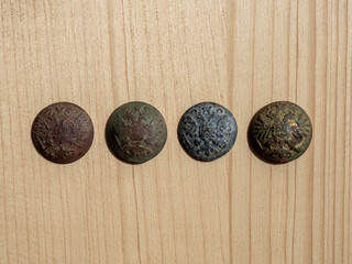 Buttons in the form of a soldier of the Russian Empire. Archaeological finds on an ancient battlefield. Copper and lead buttons with a double-headed eagle