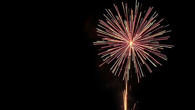 Vibrant fireworks exploding in a night sky, creating colorful sparks and dramatic light trails. - Powered by Adobe