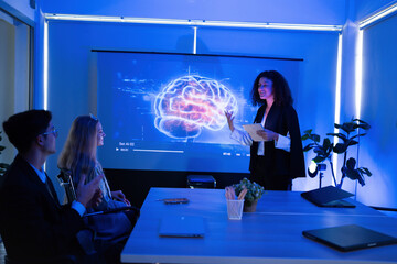 Team meeting in a modern office with a presentation about neuroscience insights