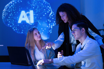 Team collaborates on artificial intelligence project in modern workspace with blue lighting