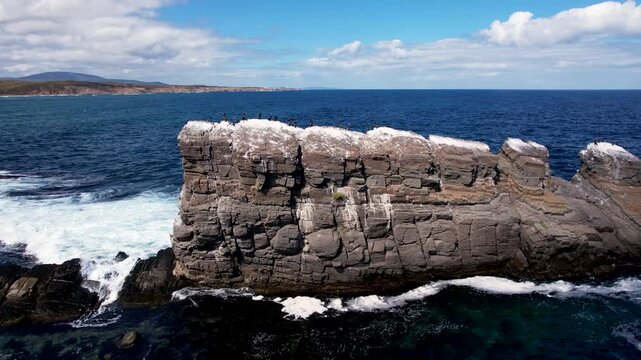 Aerial view of the rugged Stone Ships rock formation contrasting with the deep blue sea, a beautiful view in Sinemorets, The Stone Ships, Bulgaria.