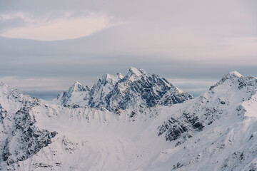 Snow covered peaks in a winter mountain range landscape in Davos