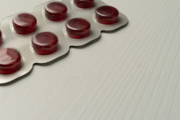 Red cough drops blister pack for throat relief