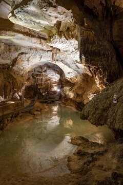 Stalactites and stalagmites, reflection in a small underground lake, rock formations in a stalactite cave, Grotta del Fico, Gulf of Orosei, Baunei, Sardinia, Italy