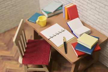 開いたノートとペン　勉強中の机　宿題　メモ帳　参考書　本　ミニチュア