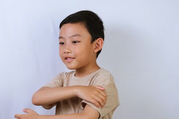 Asian Boy Portrait with Neutral Expression on White Background