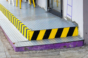 A stair strip edge trim, attaches to the front edge of a stair tread providing visual contrast effectively defining the edge of each step