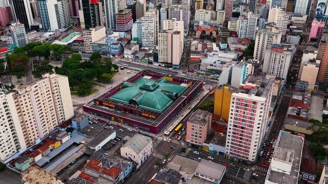 Curitiba cinematic aerial drone view showcasing the urban architecture, avenues, and vibrant downtown city center of Curitiba, Paran&aacute;, Brazil, highlighting the modern skyline, dense metropolitan view.