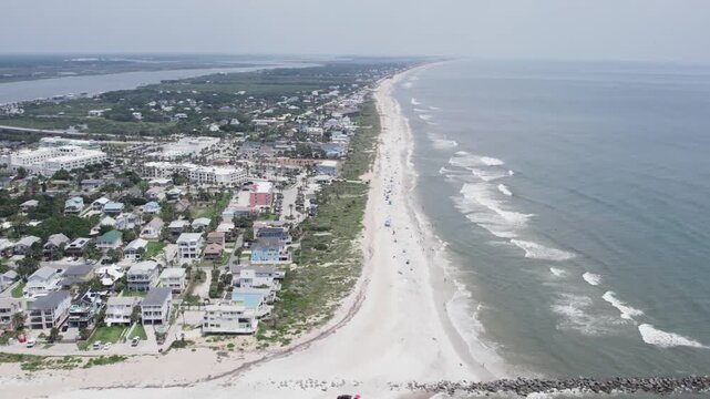 Aerial view of the coastline with homes and beach, the waves gently crashing at the shore, St. Augustine, Florida, United States.
