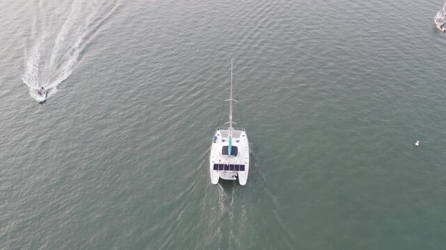 Aerial view of boats sailing on the grey-toned water, creating a dynamic scene with their contrasting wakes, St. Augustine, Florida, United States.