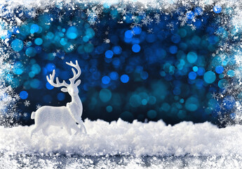 White christmas deer on the snow on a dark festive background. Merry Christmas and Happy New Year.