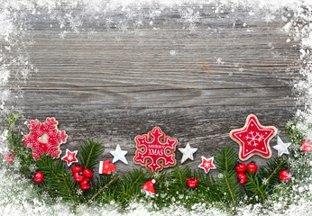 Christmas decorations and spruce branches on a wooden table. Festive background. Top view, copy space.
