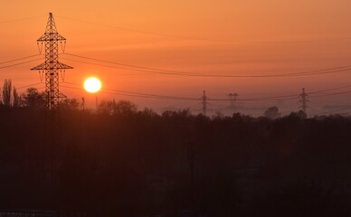 Sunrise over the city in the early morning. Winter fogy landscape