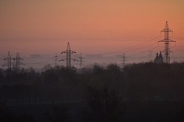 Sunrise over the city in the early morning. Winter fogy landscape