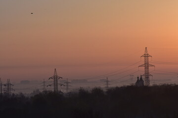 Sunrise over the city in the early morning. Winter fogy landscape