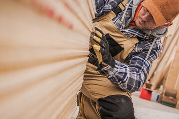 Craftsman Working With Wood in a Workshop During Daylight Hours
