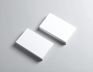 Stack of Blank White Business Cards on a Light Gray Surface image photo