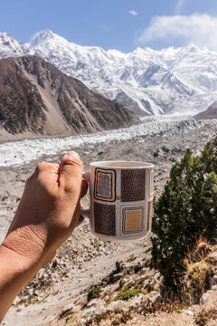 Cupo of tea above Rakhiot glacier under Nanga Parbat mountain in Gilgit-Baltistan region in Pakistan