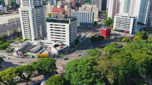 Curitiba cinematic aerial drone view showcasing the urban architecture, avenues, and vibrant downtown city center of Curitiba, Paran&aacute;, Brazil, highlighting the modern skyline, dense metropolitan view.