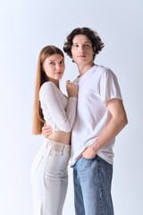 Fototapeta premium Happy young couple in love enjoying a cozy moment in a grey studio setting