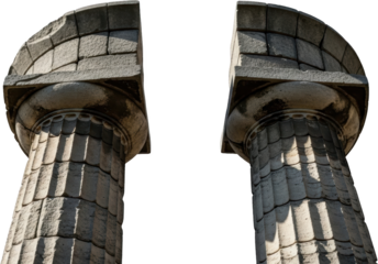 Fragments Of Two Ancient Weathered Stone Columns Displaying Carved Fluting And Ornate Capitals Stand Against A Stark Transparent Background Showing Texture And Shadow Detail Architecture