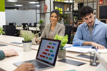 Diverse business team collaborating in modern office meeting