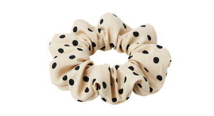 Beige and black polka dot scrunchie isolated a stylish hair accessory on transparent background.