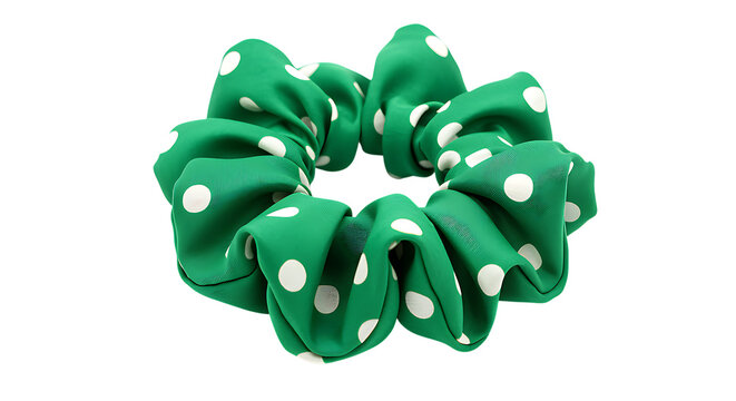 A vibrant green scrunchie with white polka dots presented beautifully on transparent background.