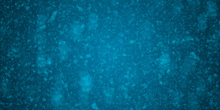 Fondo navide&ntilde;o azul en degradado con copos de nieve difuminados y destellos de luz invernal