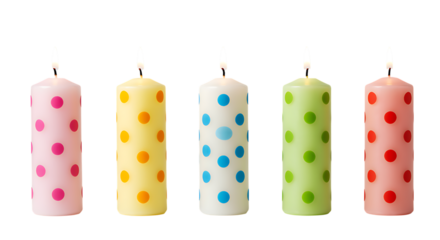Five colorful polka dot candles arranged in a row on transparent background.