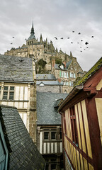 Mont Saint-Michel Medieval Village and Abbey with Birds Flying, Normandy, France