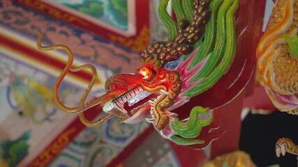 SARABURI, THAILAND - DECEMBER 21, 2025: Traditional red lanterns and dragon decorations at a Chinese temple festival ahead of Chinese New Year 2026.