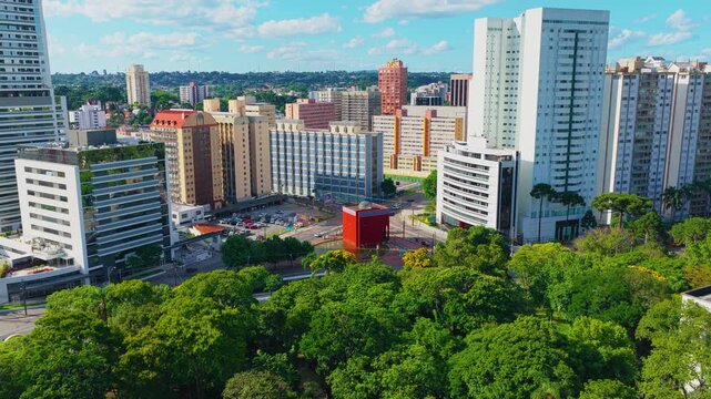 Curitiba cinematic aerial drone view showcasing the urban architecture, avenues, and vibrant downtown city center of Curitiba, Paran&aacute;, Brazil, highlighting the modern skyline, dense metropolitan view.