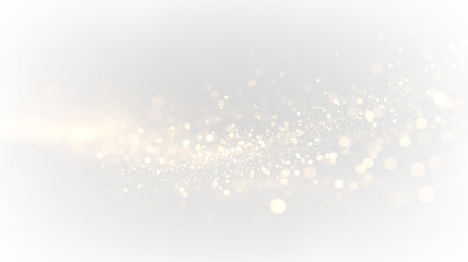 Golden particles scatter across a transparent background in an abstract design during the day