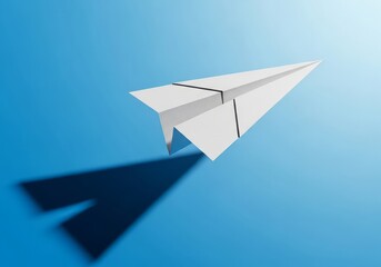 A solitary white paper airplane glides through a gradient blue sky casting a dark shadow below, symbolizing travel and imagination