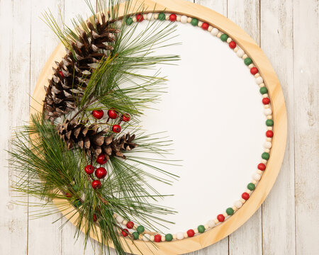 Christmas holiday round flatlay with room for adding words or invitations.