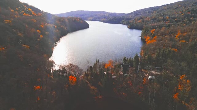 Lac-du-Sable, Canada - Oct.19 2025: The colourful autumn foliage 4k drone aerial view of Lac-du Sable in Quebec Canda