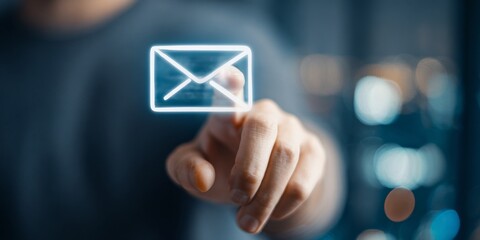 Person Interacting with Digital Envelope Icon on a Modern Interface, Highlighting Notification of New Messages on Smartphone in Soft Focus Background