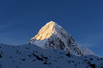 Pumo Ri summit viewed from Lobuche. Sunset in Himalaya mountains on Everest base camp trekking in Nepal.